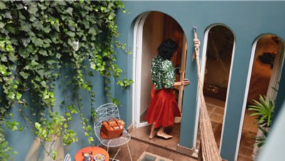 Woman entering a rental home.