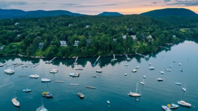 A large body of water in Maine filled with lots of boats